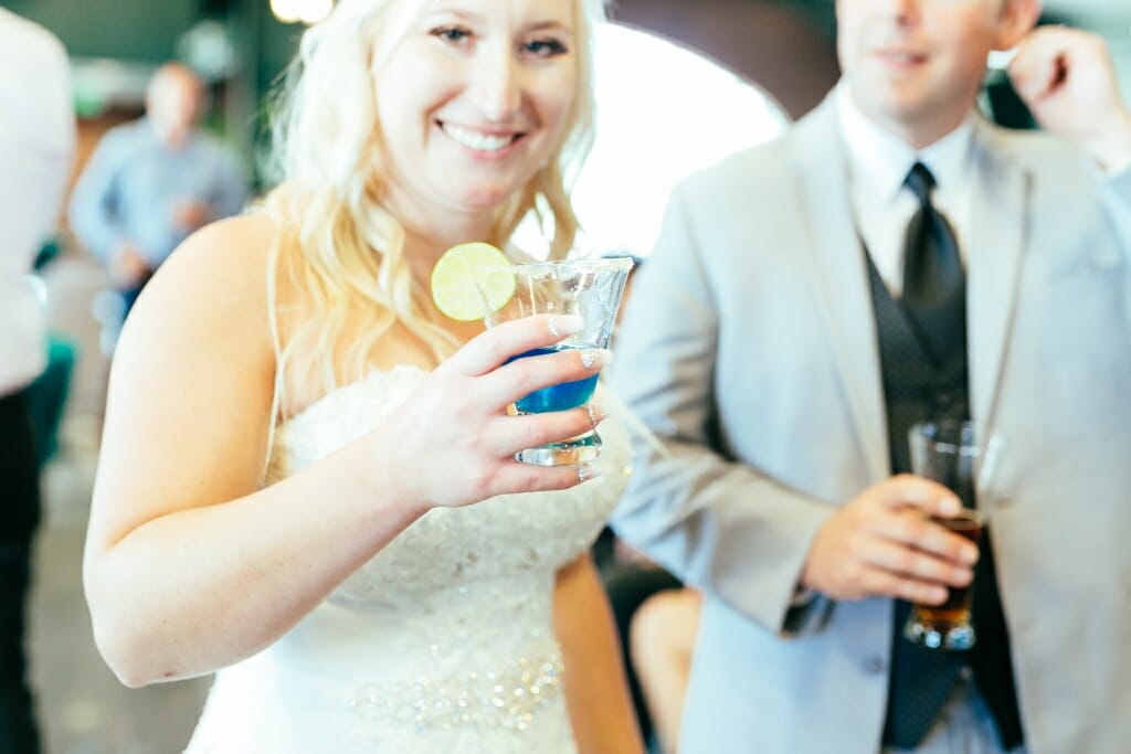 The bride and groom enjoying cocktail hour with guests